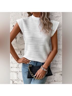 White wave pattern designed top with cap sleeves new in bag. Various sizes